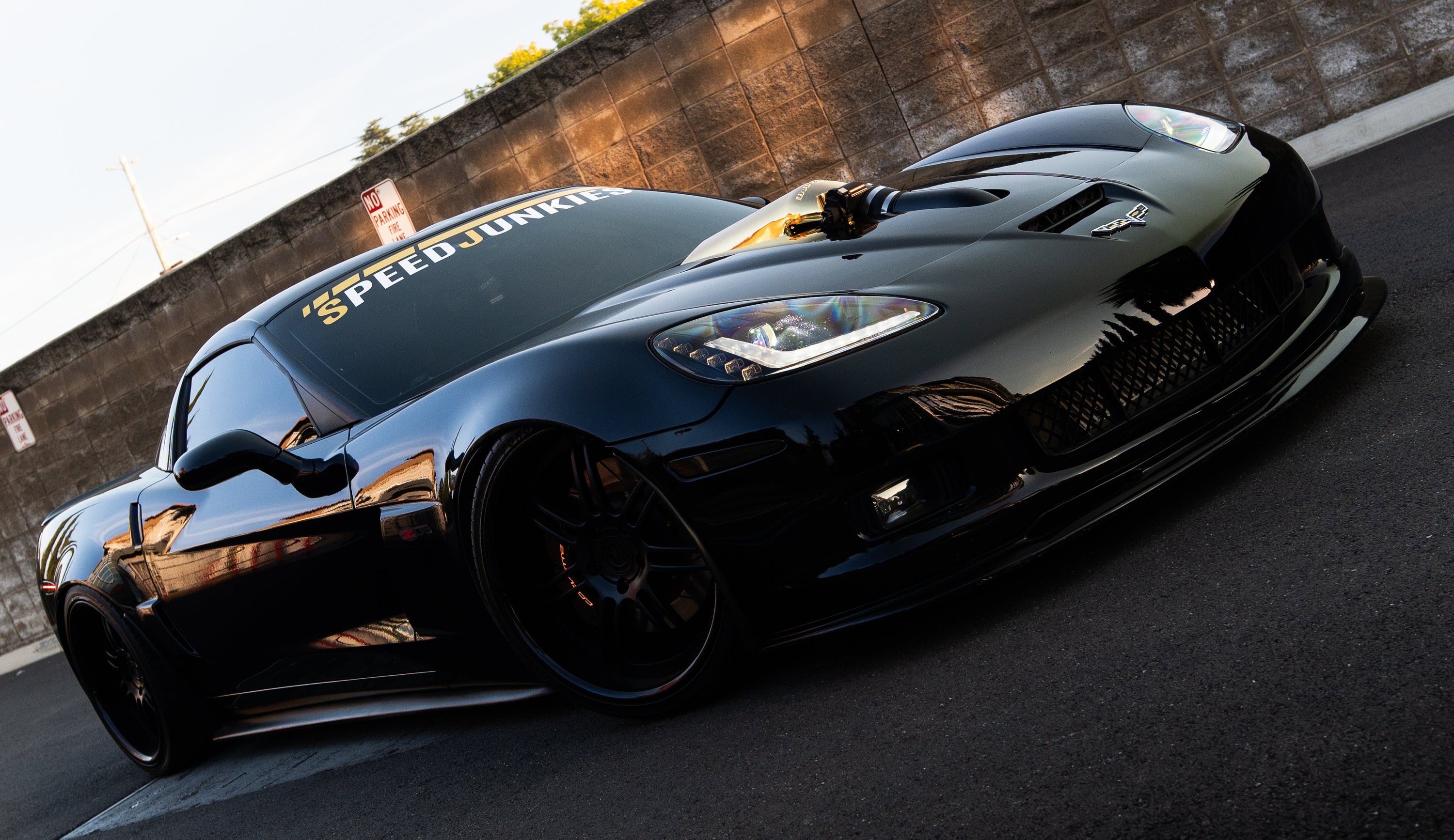 Black sports car on a racetrack with a blurred background